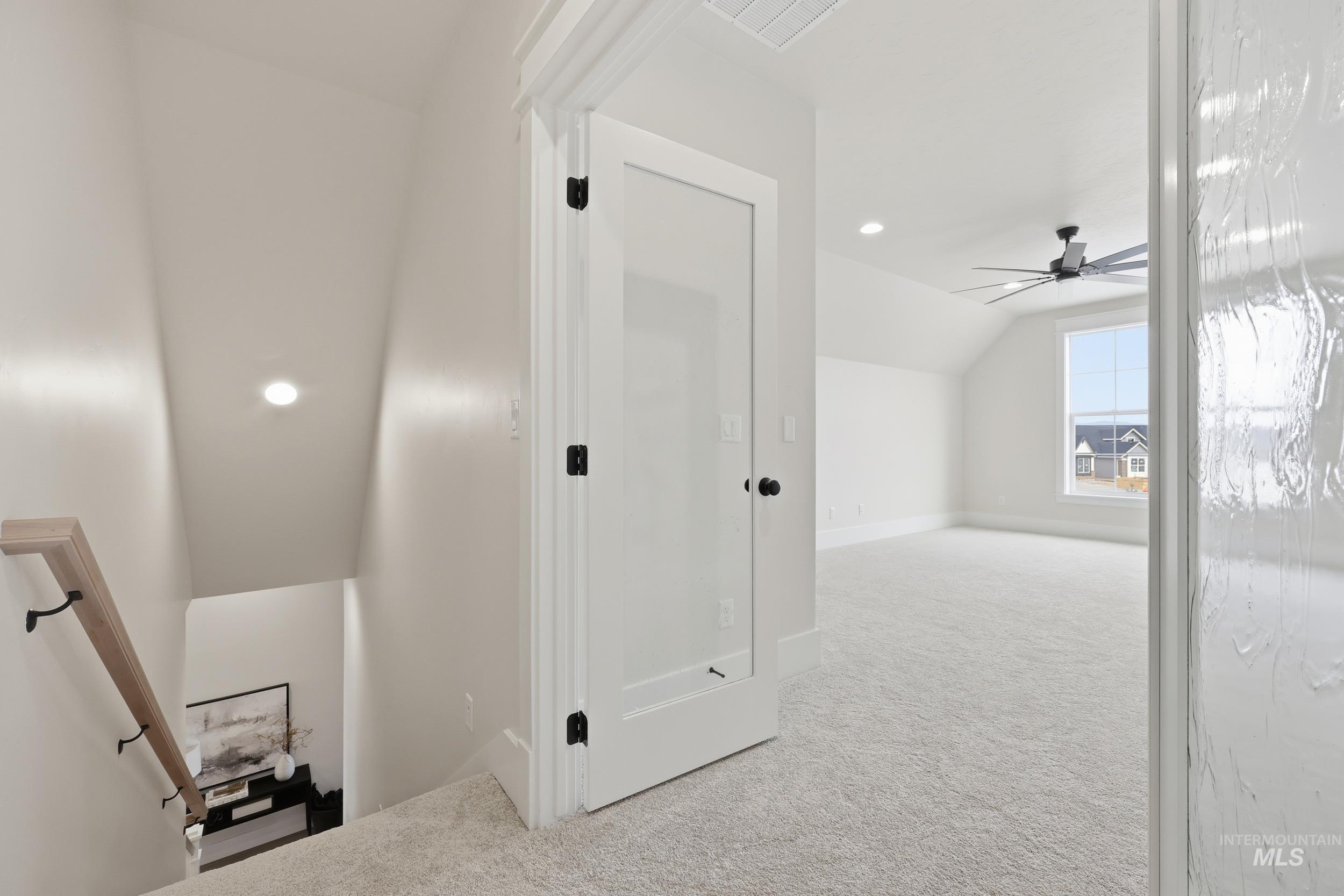 6513 South Utmost Way Meridian, ID 83642 - Photo 36 of 47 Additional living space featuring light colored carpet, recessed lighting, vaulted ceiling, and ceiling fan