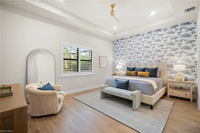 a bedroom with a bed and a couch