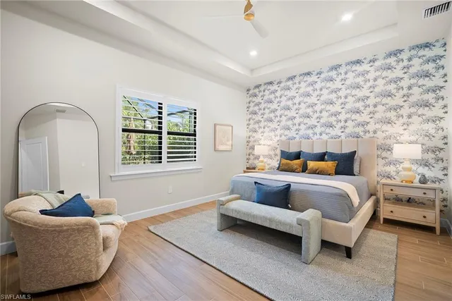 a bedroom with a bed and couch