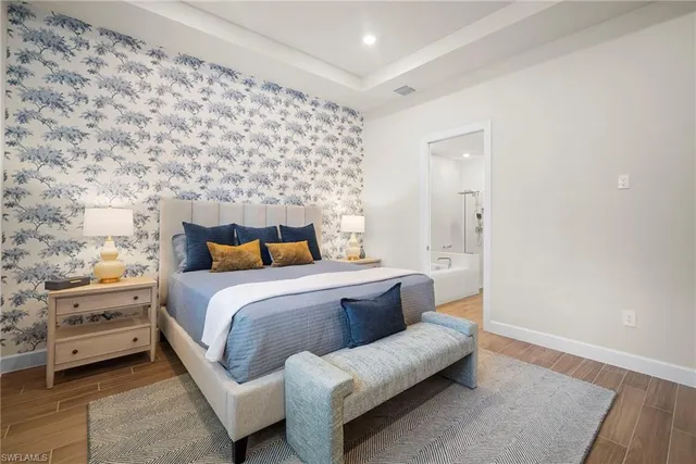 a bedroom with a bed and a couch