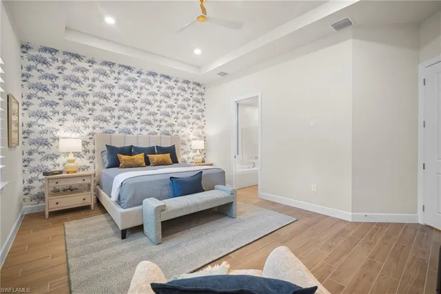 a bedroom with a bed and a couch