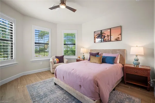 a bedroom with bed and a window