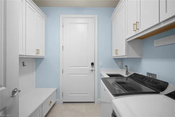 a white stove top oven sitting inside of a kitchen