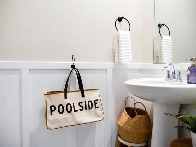 a bathroom with a sink and mirror