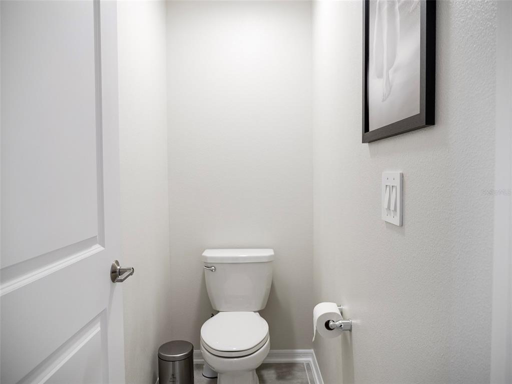 2949 Muller Oak Loop Ocoee, FL 34761 - Photo 23 of 36 a white toilet sitting next to a white cabinet