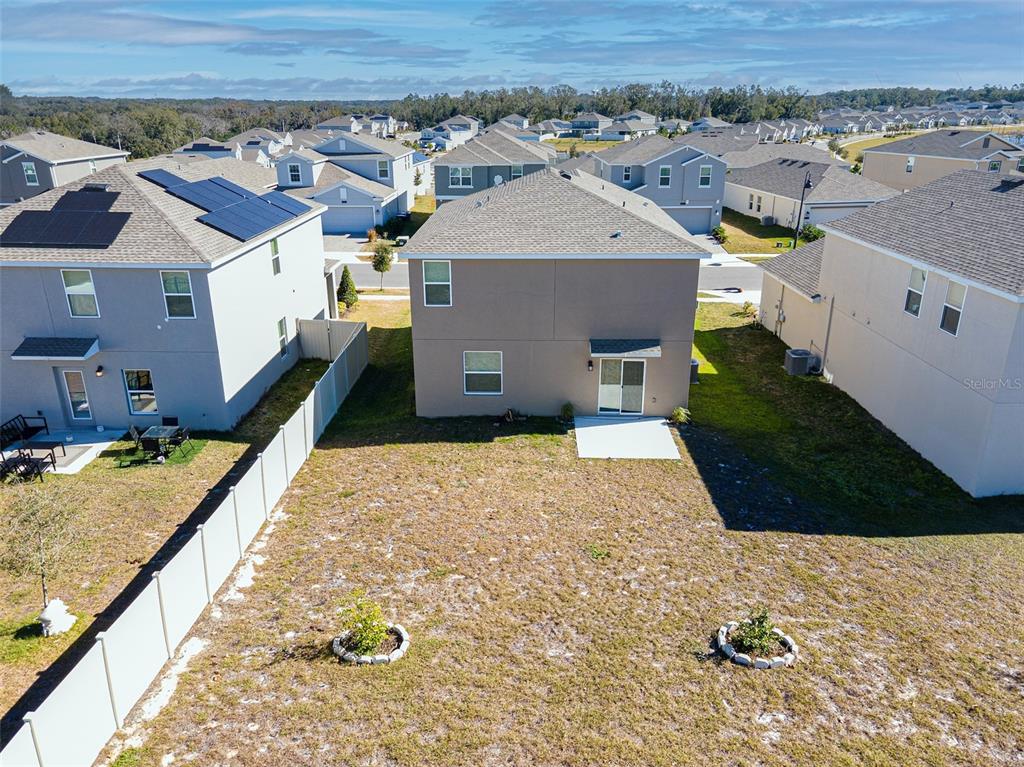 2949 Muller Oak Loop Ocoee, FL 34761 - Photo 36 of 36 an aerial view of a house with a yard