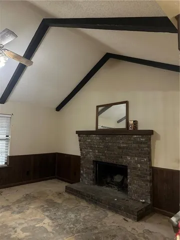 a view of fireplace with washer and dryer