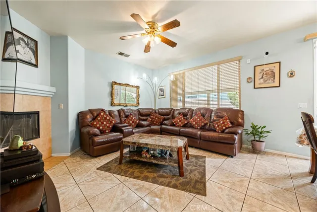 a kitchen with stainless steel appliances granite countertop a refrigerator a sink and a stove