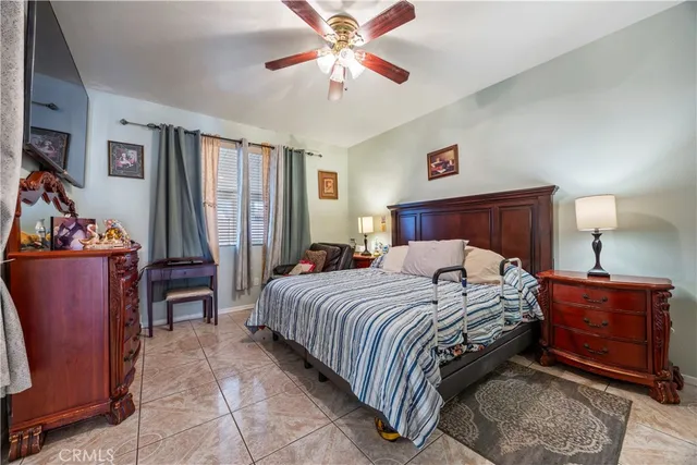a bedroom with two beds and book shelf