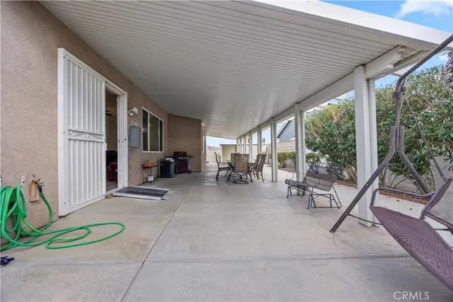 a view of a livingroom with furniture and window