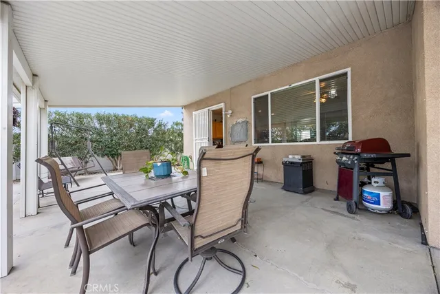 a view of a porch with seating space