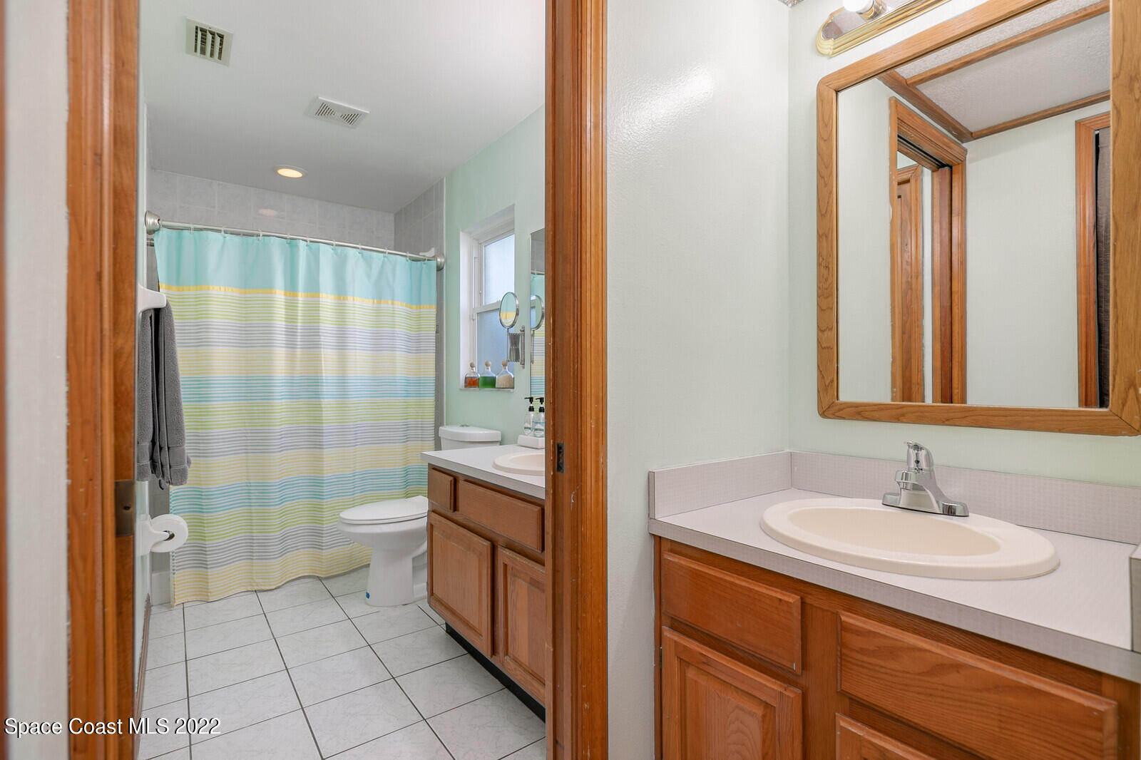 6385 Banks Avenue Cocoa, FL 32927 - Photo 11 of 47 a bathroom with a sink a toilet and shower
