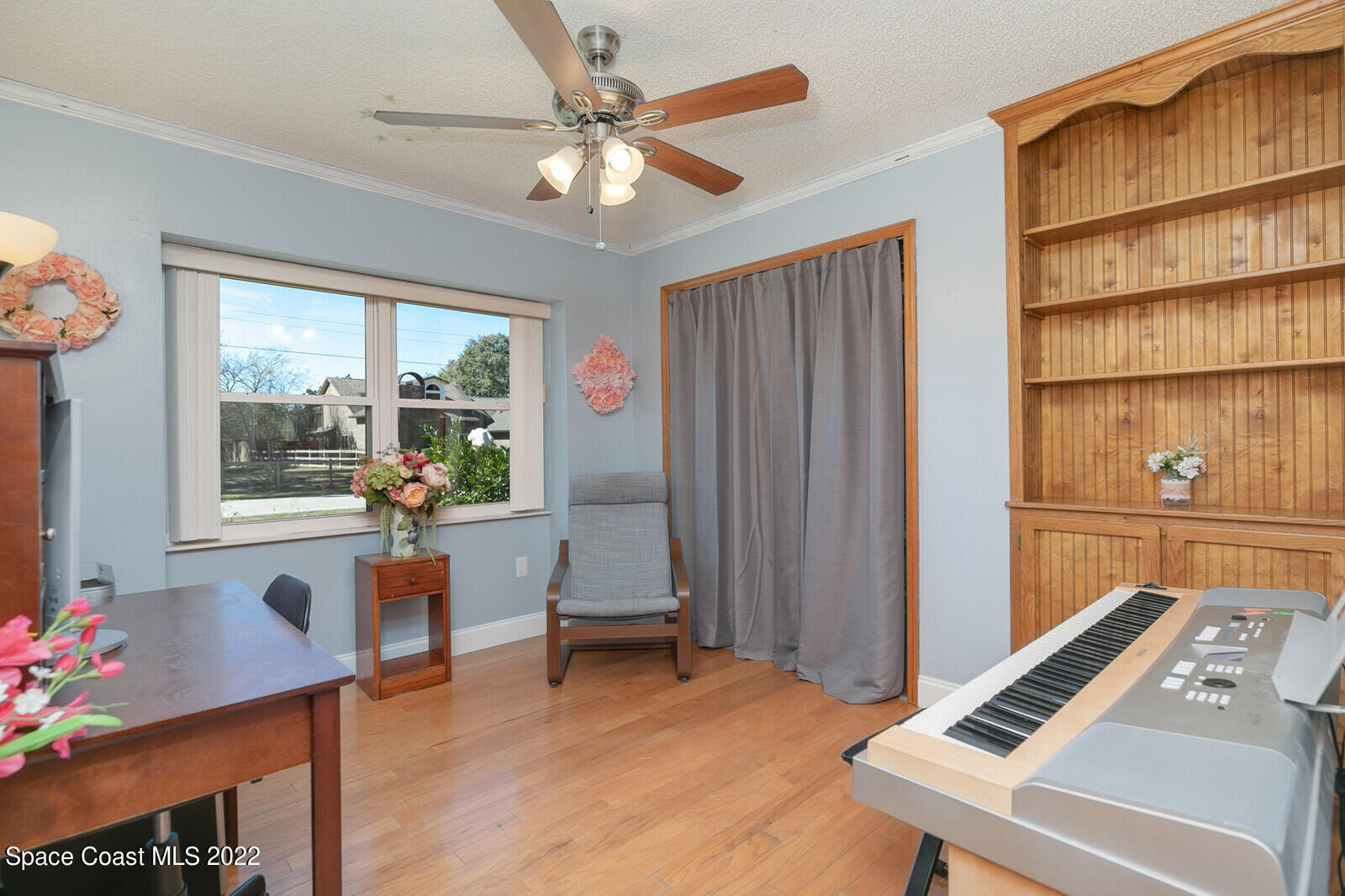 6385 Banks Avenue Cocoa, FL 32927 - Photo 12 of 47 a view of a workspace with furniture and a window
