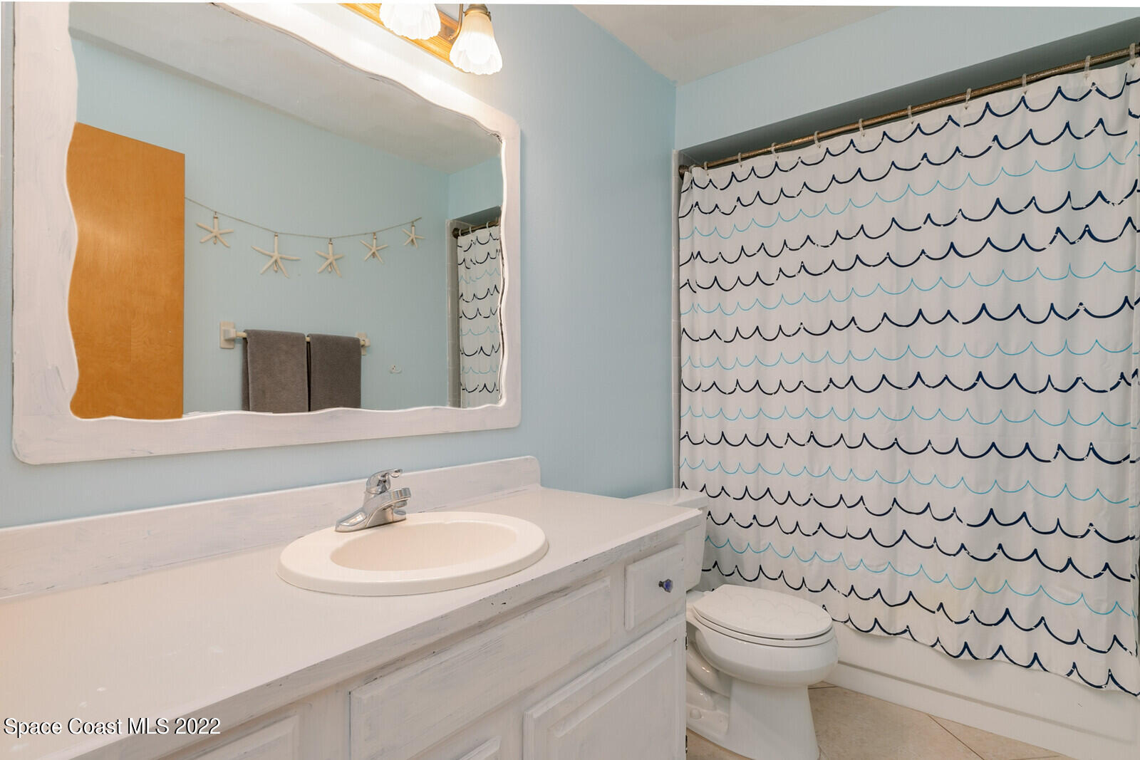 6385 Banks Avenue Cocoa, FL 32927 - Photo 15 of 47 a bathroom with a sink toilet and shower