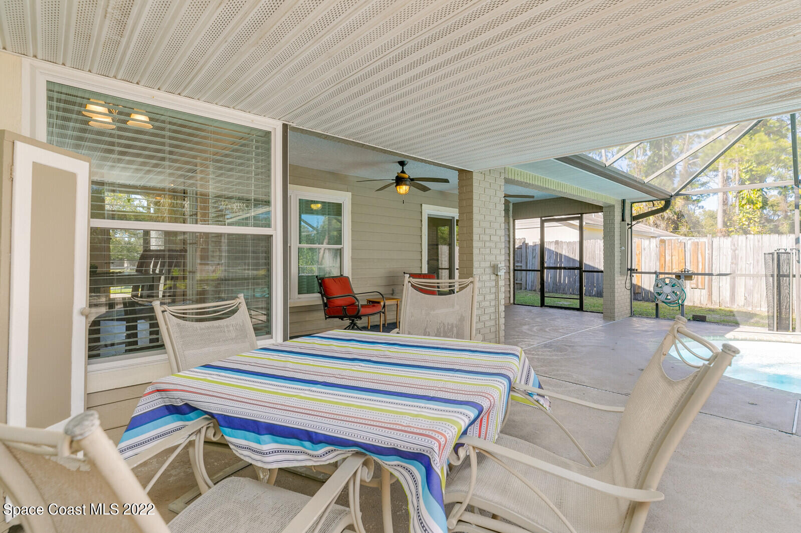 6385 Banks Avenue Cocoa, FL 32927 - Photo 17 of 47 a living room with a couch and large windows