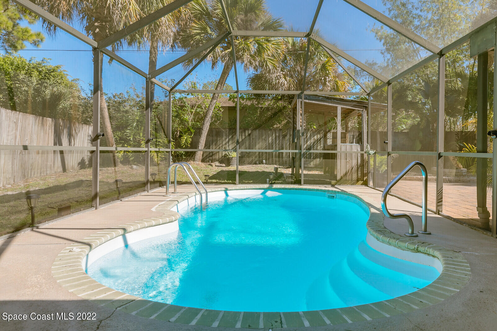 6385 Banks Avenue Cocoa, FL 32927 - Photo 18 of 47 a view of a swimming pool with a patio