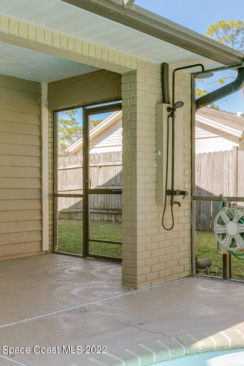 6385 Banks Avenue Cocoa, FL 32927 - Photo 19 of 47 a view of a room that has a large window and glass door