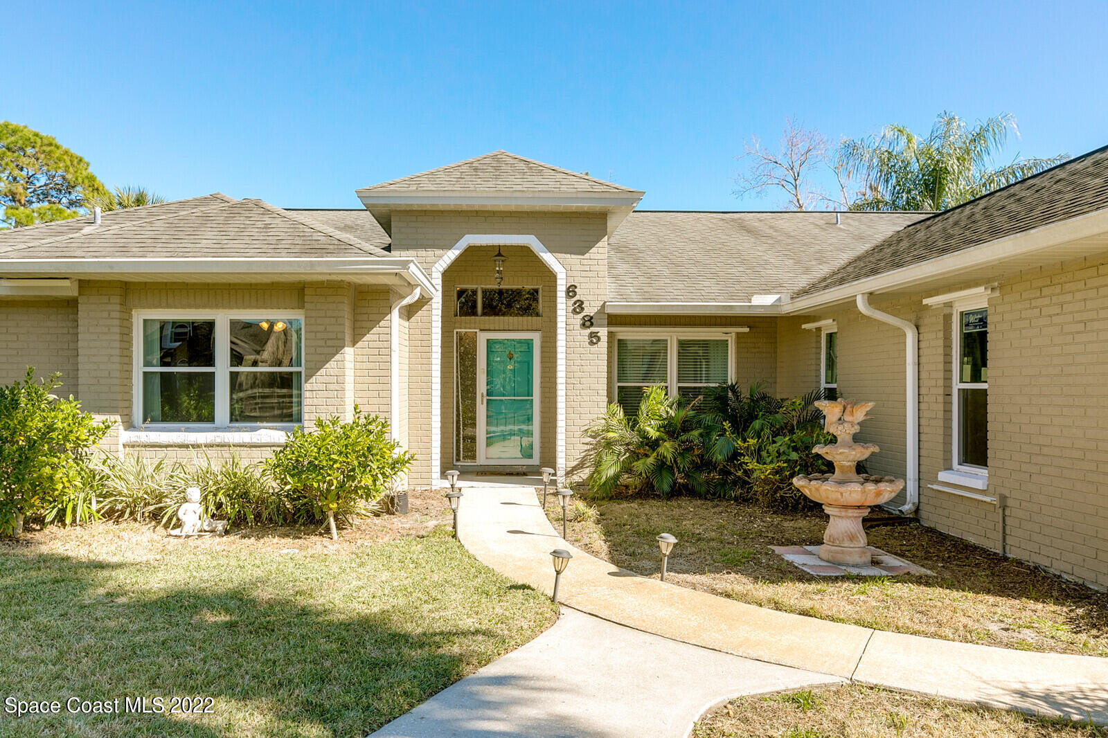 6385 Banks Avenue Cocoa, FL 32927 - Photo 25 of 47 a front view of a house with garden