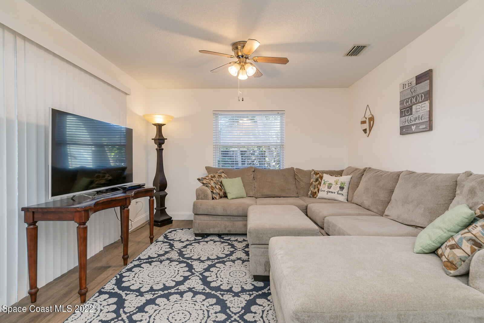 6385 Banks Avenue Cocoa, FL 32927 - Photo 26 of 47 a living room with furniture and a flat screen tv