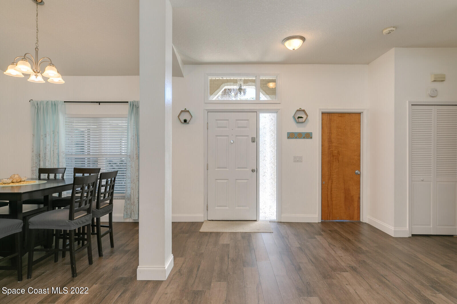6385 Banks Avenue Cocoa, FL 32927 - Photo 27 of 47 a view of a dining room with furniture and wooden floor