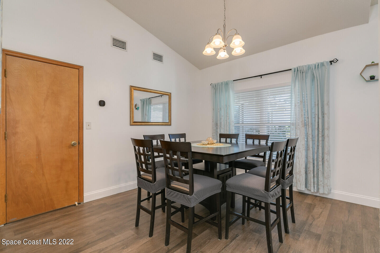 6385 Banks Avenue Cocoa, FL 32927 - Photo 30 of 47 a view of a dining room with furniture and wooden floor