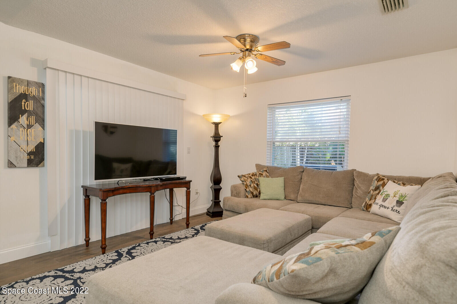 6385 Banks Avenue Cocoa, FL 32927 - Photo 31 of 47 a living room with furniture and a flat screen tv