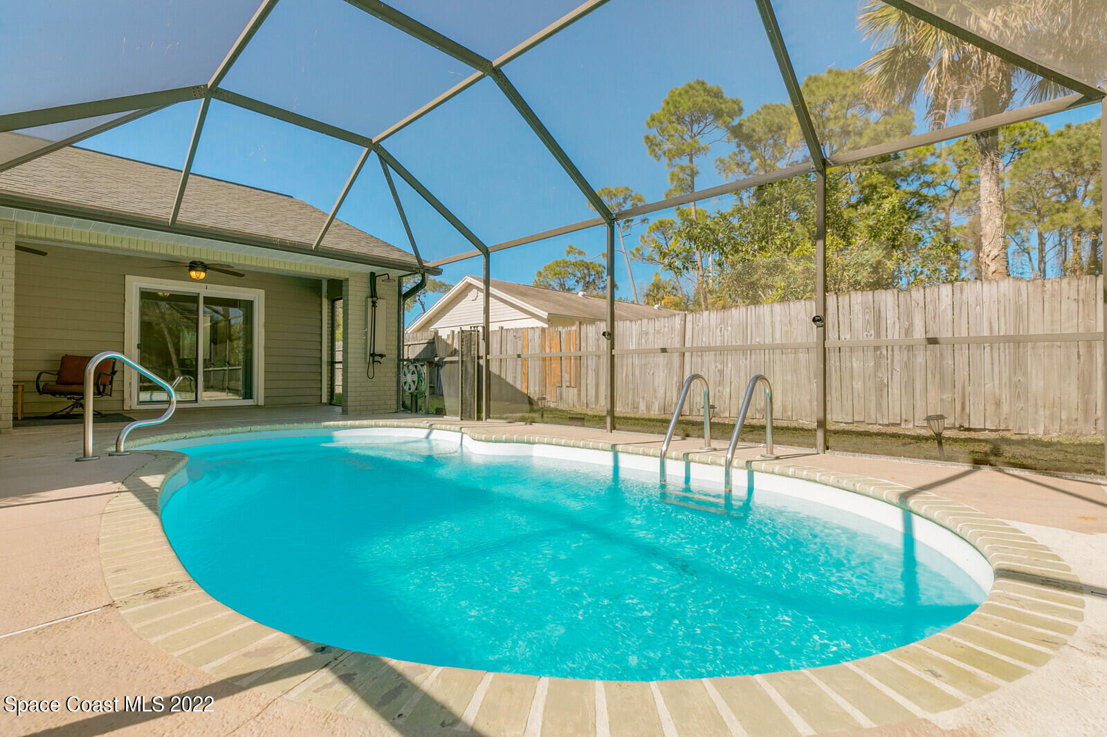 6385 Banks Avenue Cocoa, FL 32927 - Photo 34 of 47 a swimming pool with yard and outdoor seating