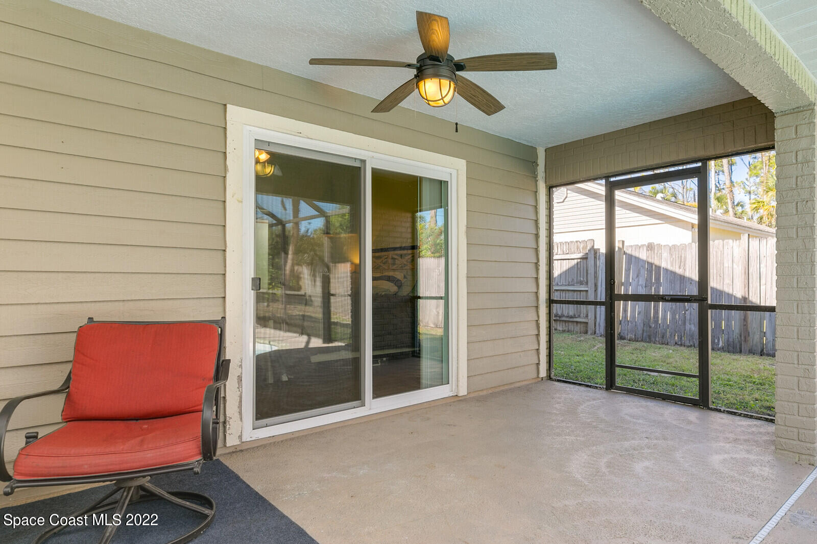 6385 Banks Avenue Cocoa, FL 32927 - Photo 36 of 47 a view of a room with wooden floor and a ceiling fan