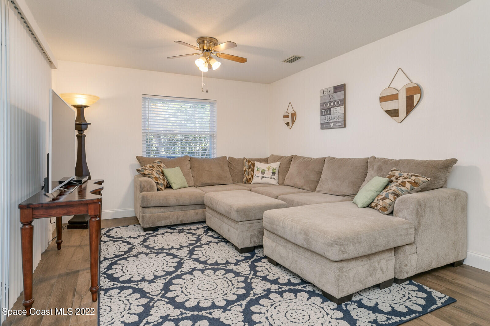 6385 Banks Avenue Cocoa, FL 32927 - Photo 4 of 47 a living room with furniture and a chandelier