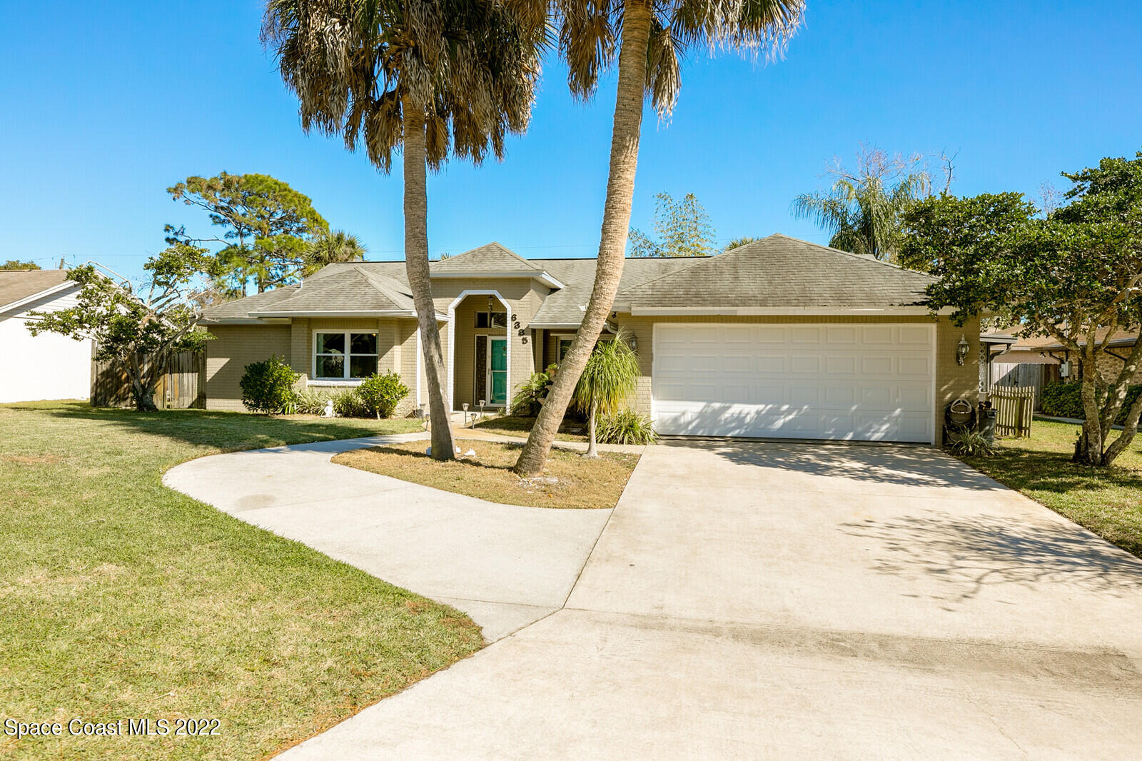 6385 Banks Avenue Cocoa, FL 32927 - Photo 46 of 47 a front view of a house with a garage