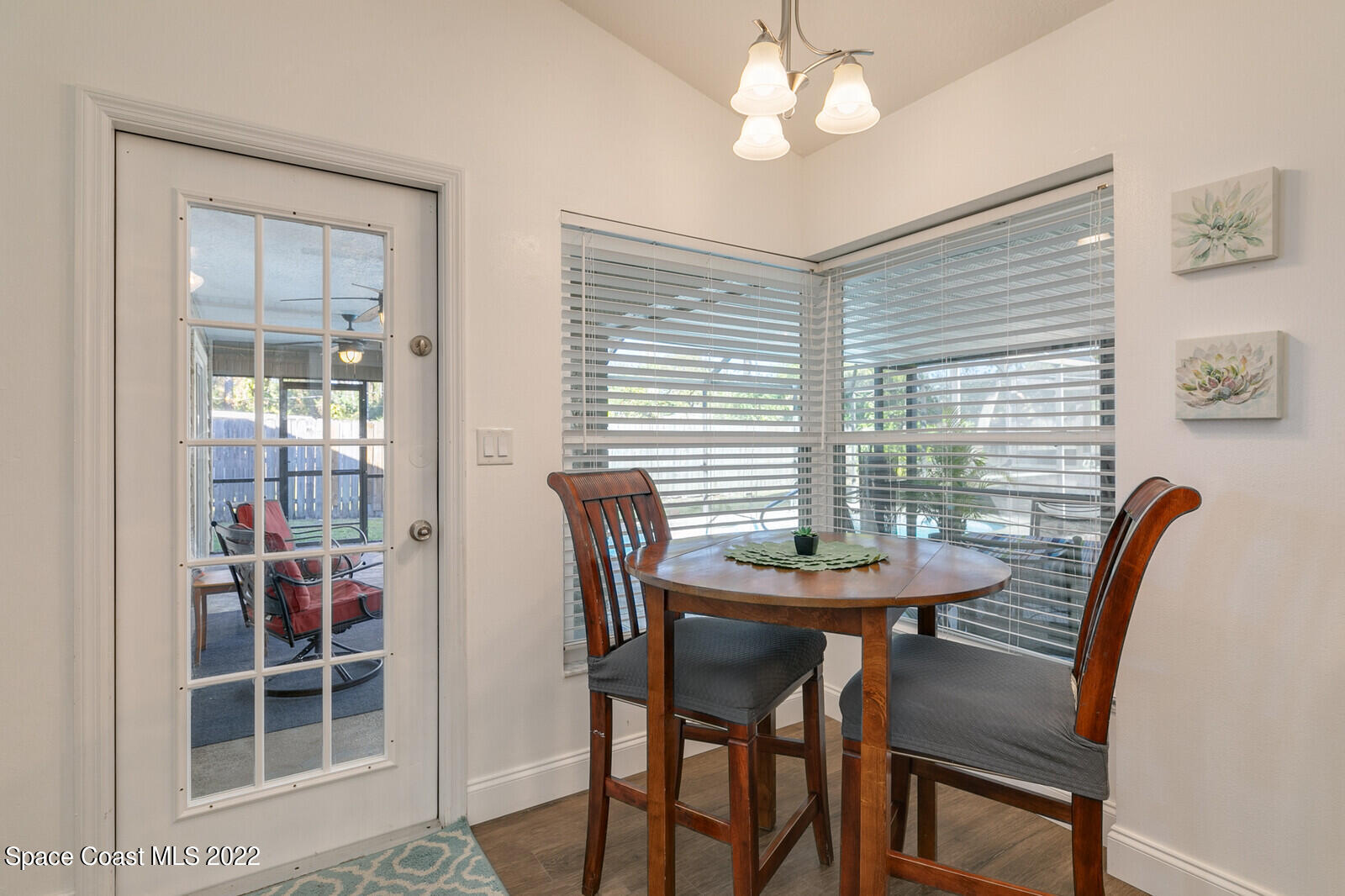 6385 Banks Avenue Cocoa, FL 32927 - Photo 8 of 47 a view of a dining room with furniture and chandelier