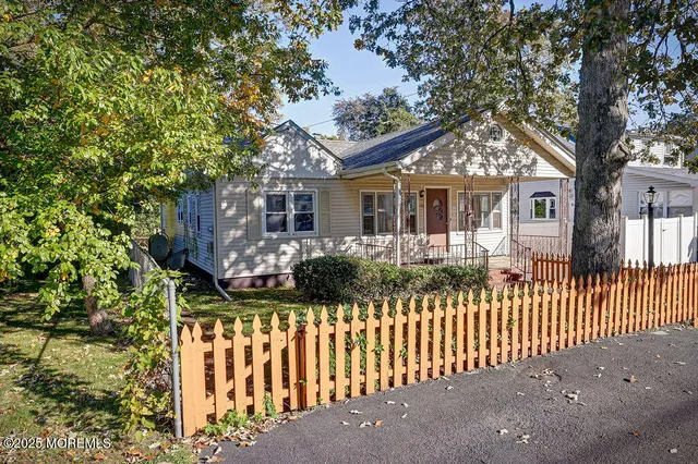 a front view of house with a garden