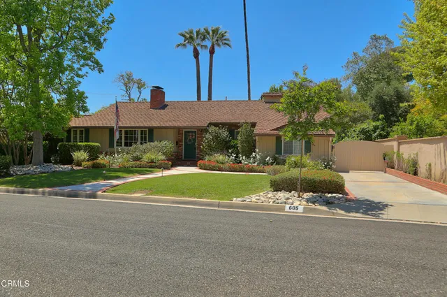 a view of house with outdoor space and yard