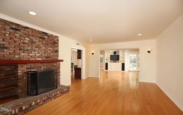 a view of a kitchen with a stove cabinets and wooden floor