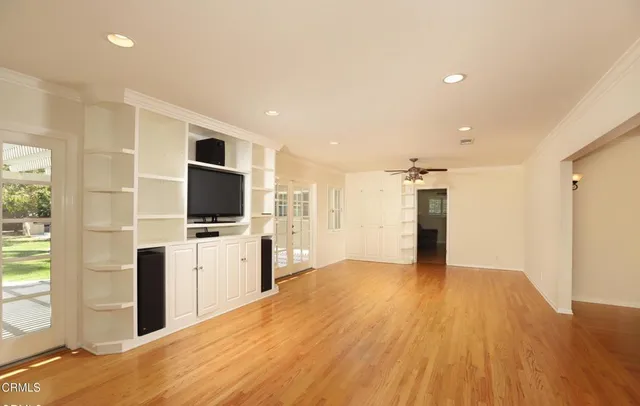 a view of a kitchen with microwave and refrigerator