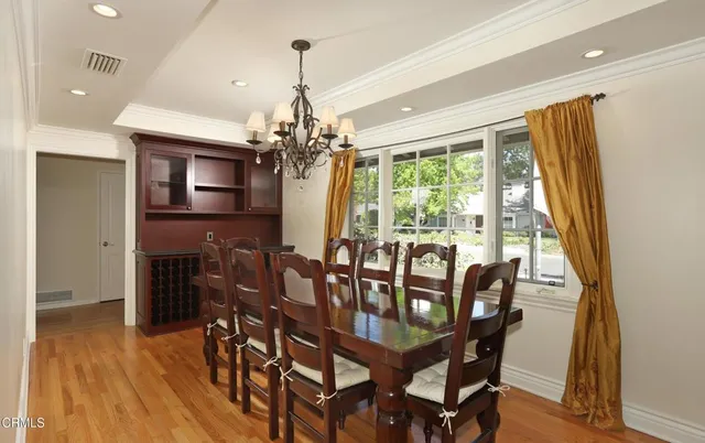 a view of a room with wooden floor and white walls