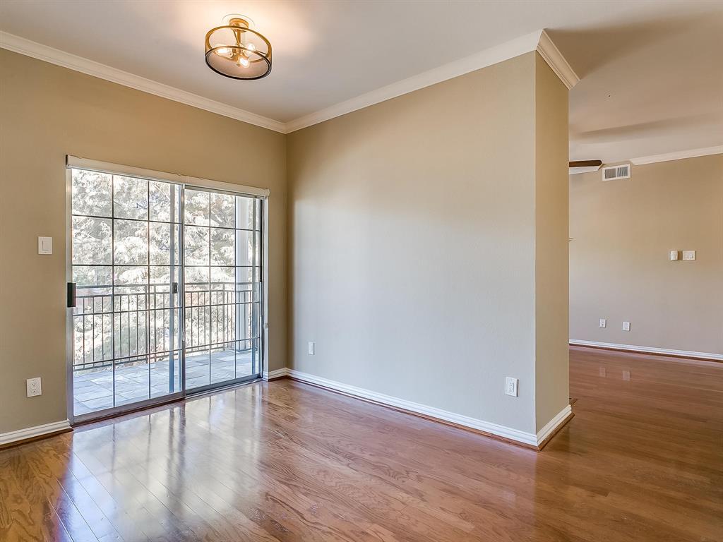 2524 Preston Road, Unit 1303 Plano, TX 75093 - Photo 12 of 28 an empty room with wooden floor and windows