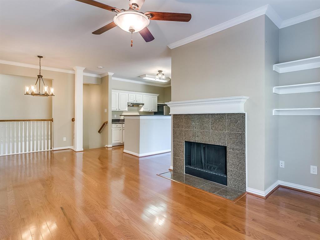 2524 Preston Road, Unit 1303 Plano, TX 75093 - Photo 14 of 28 a view of an empty room with wooden floor fireplace and a window