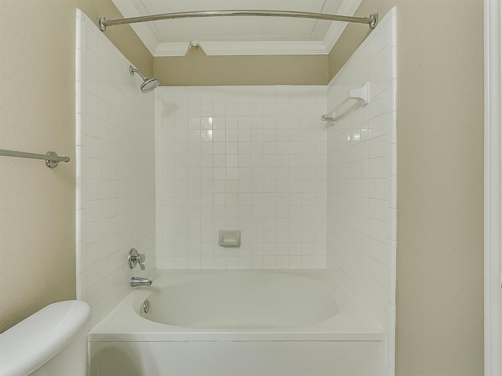 2524 Preston Road, Unit 1303 Plano, TX 75093 - Photo 19 of 28 a bathroom with a bathtub