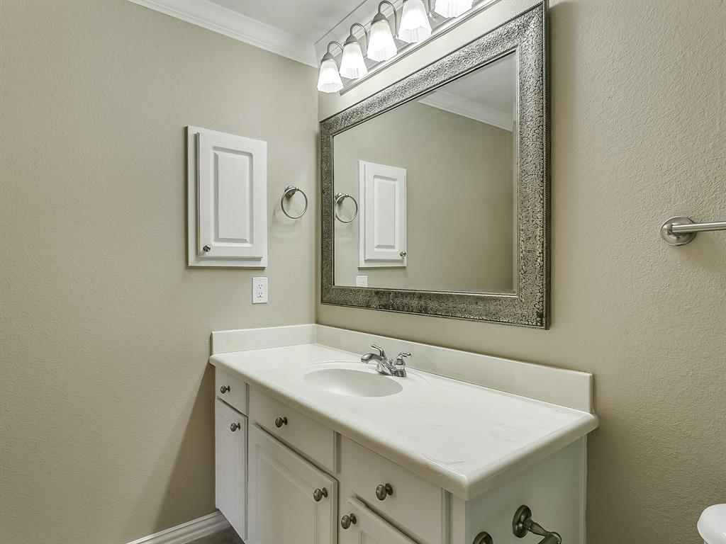 2524 Preston Road, Unit 1303 Plano, TX 75093 - Photo 20 of 28 a bathroom with a sink vanity and a mirror