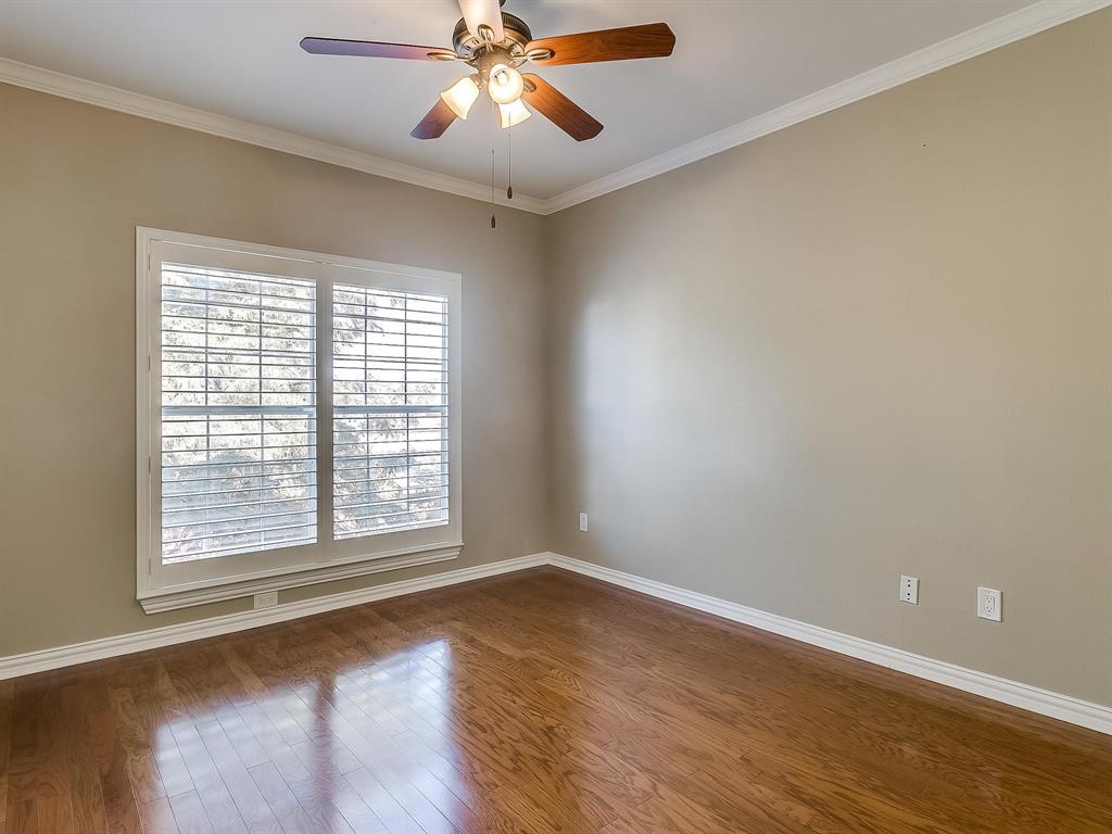 2524 Preston Road, Unit 1303 Plano, TX 75093 - Photo 21 of 28 a view of an empty room with wooden floor and a window