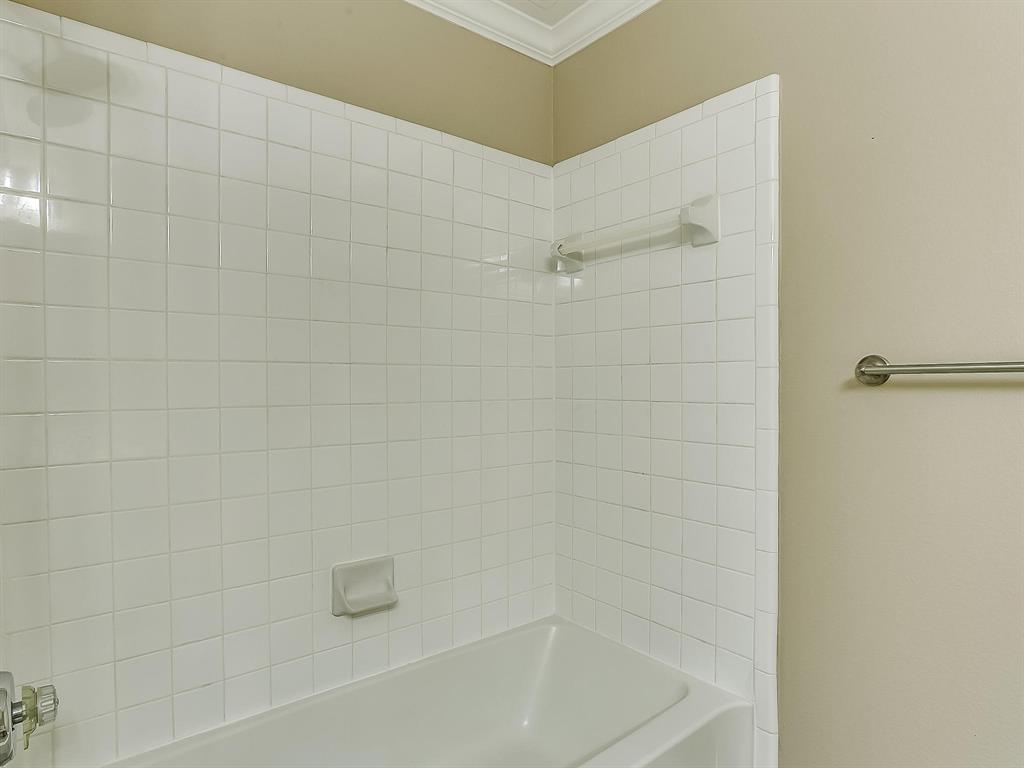 2524 Preston Road, Unit 1303 Plano, TX 75093 - Photo 25 of 28 a bathroom with a bathtub
