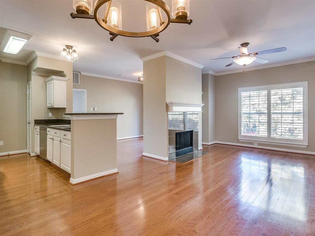 2524 Preston Road, Unit 1303 Plano, TX 75093 - Photo 6 of 28 a view of a kitchen with a stove cabinets and wooden floor