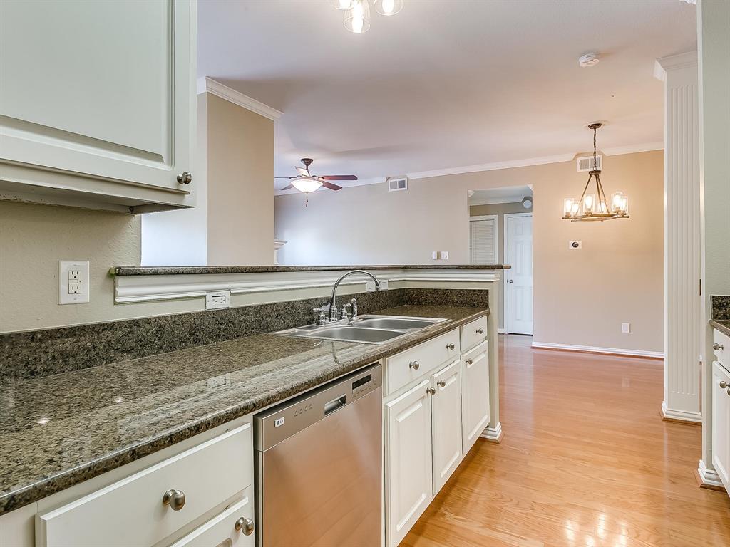 2524 Preston Road, Unit 1303 Plano, TX 75093 - Photo 10 of 28 a kitchen with a sink and a stove