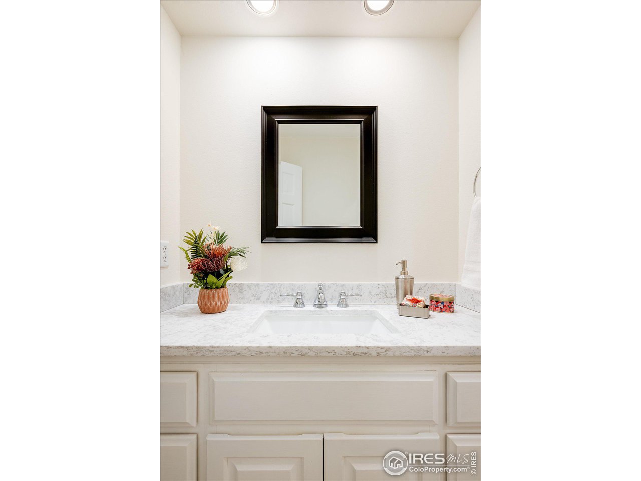 6919 Frying Pan Road Boulder, CO 80301 - Photo 14 of 36 a bathroom with a sink and a mirror
