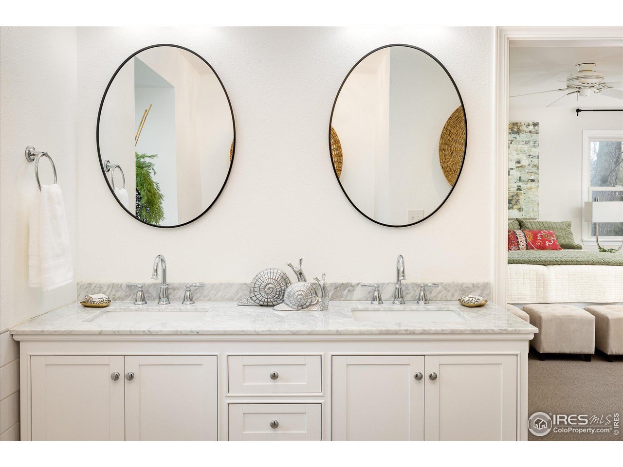 6919 Frying Pan Road Boulder, CO 80301 - Photo 19 of 36 a bathroom with a sink and a mirror