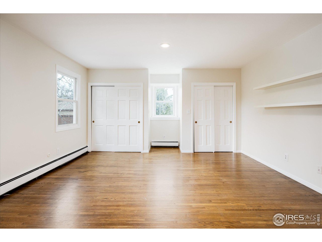6919 Frying Pan Road Boulder, CO 80301 - Photo 23 of 36 a view of an empty room with wooden floor