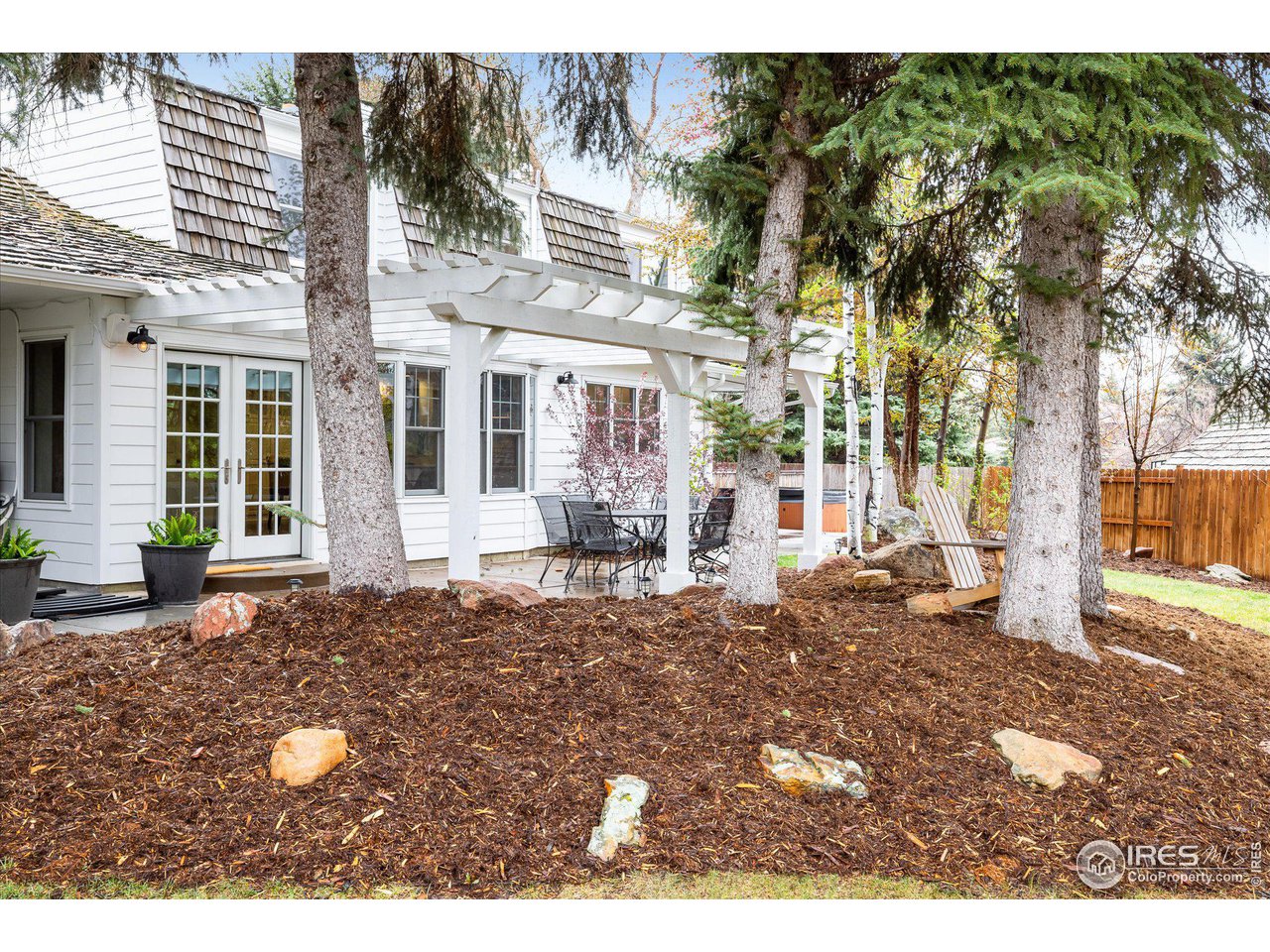 6919 Frying Pan Road Boulder, CO 80301 - Photo 32 of 36 a backyard of a house with yard and outdoor seating