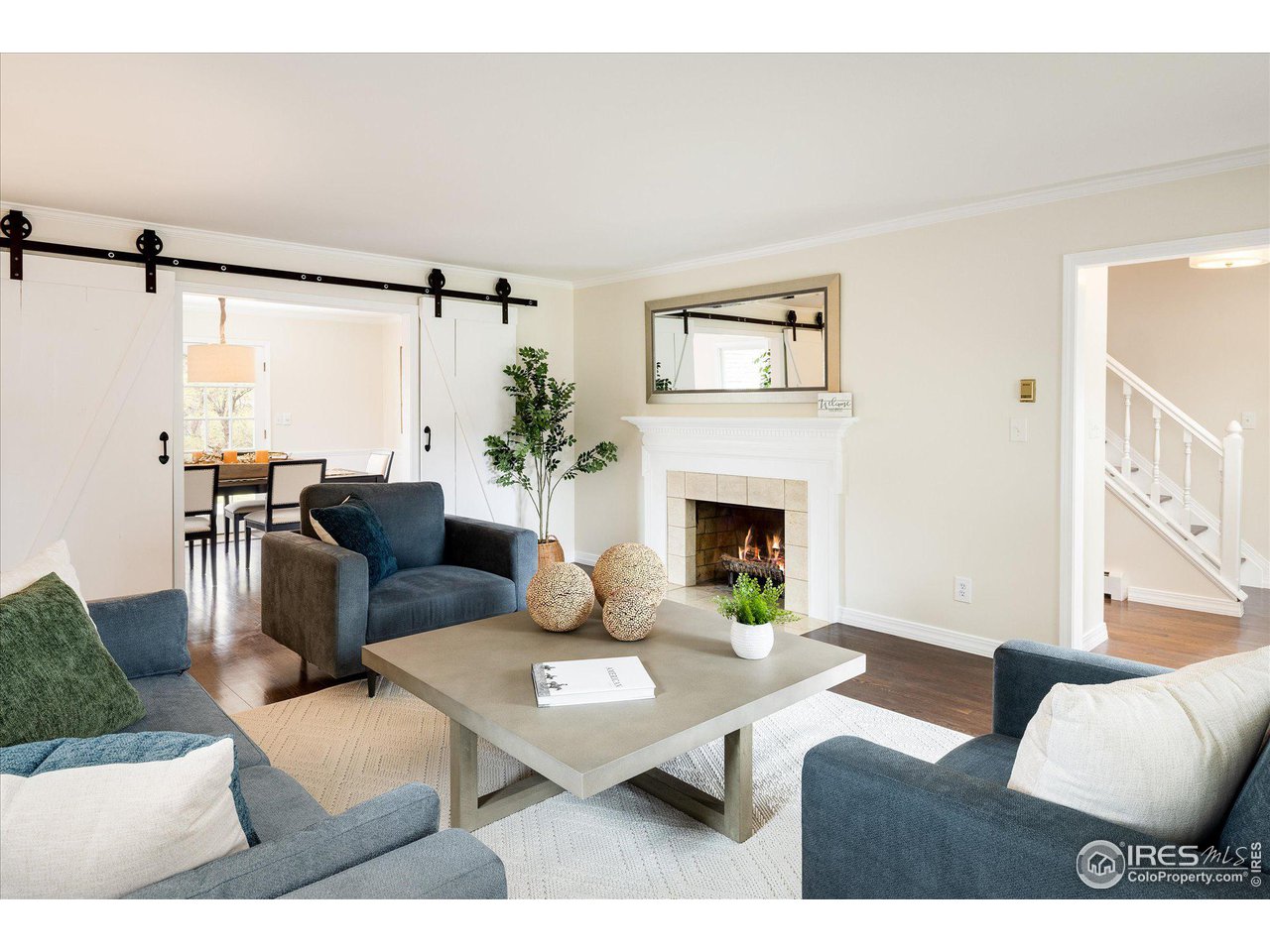 6919 Frying Pan Road Boulder, CO 80301 - Photo 4 of 36 a living room with furniture a rug and a fireplace
