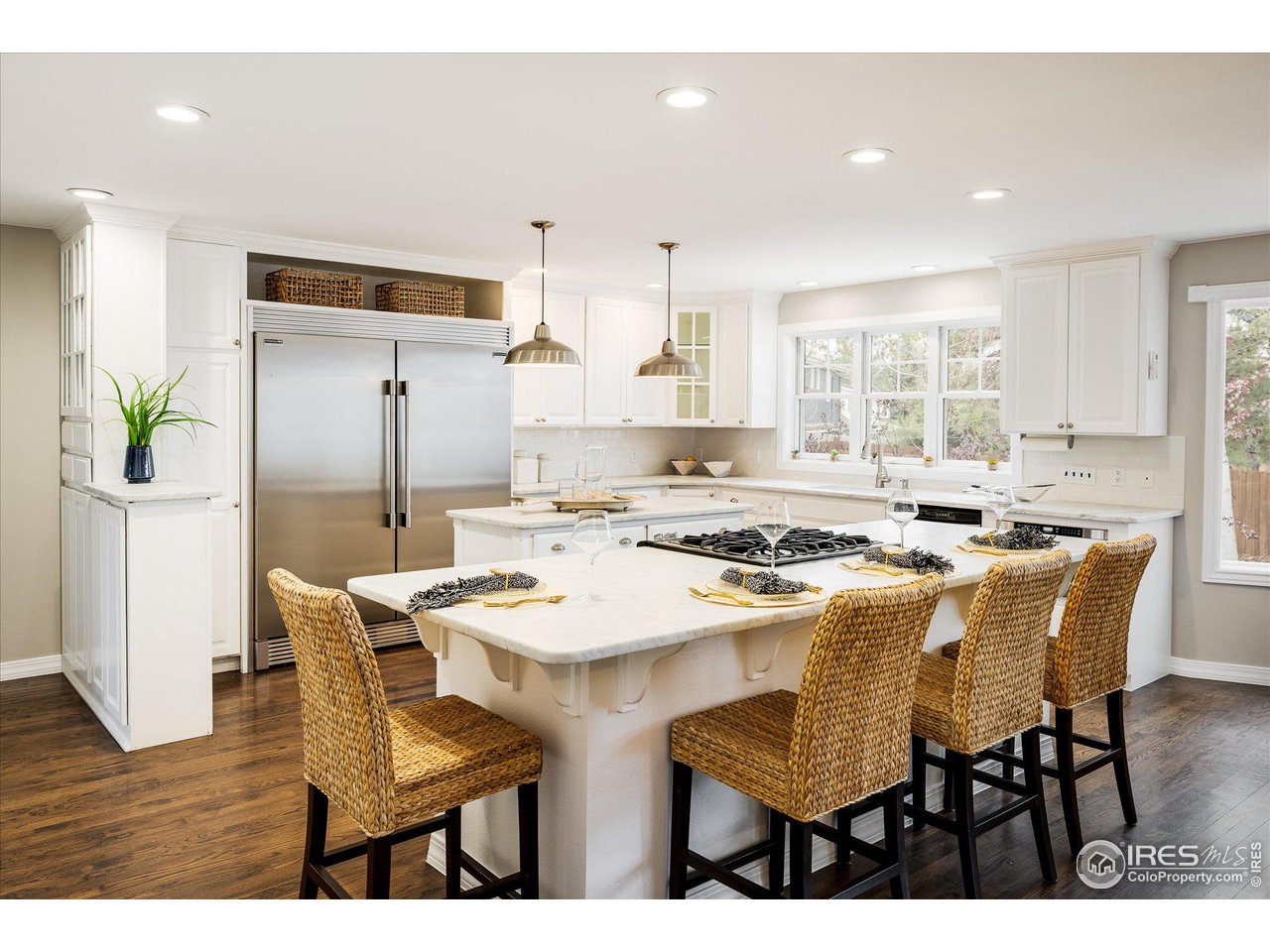 6919 Frying Pan Road Boulder, CO 80301 - Photo 6 of 36 a kitchen with a dining table chairs and refrigerator